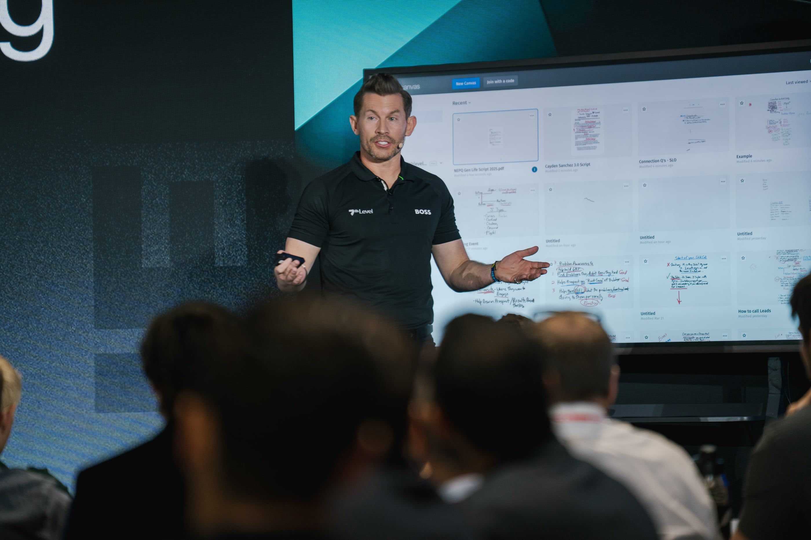 Jeremy Miner walking the room through a sales script on a large screen